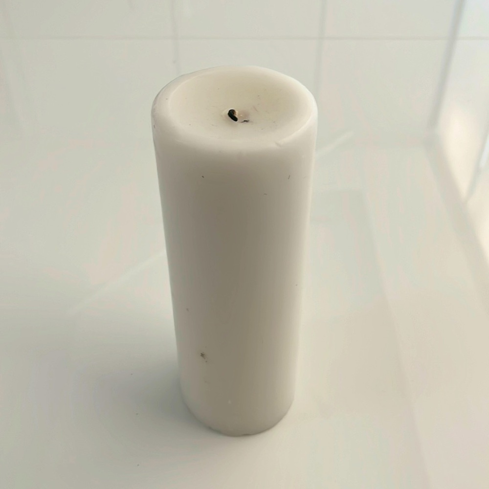 Unscented Wax Pillar Candle. Used couple of times.